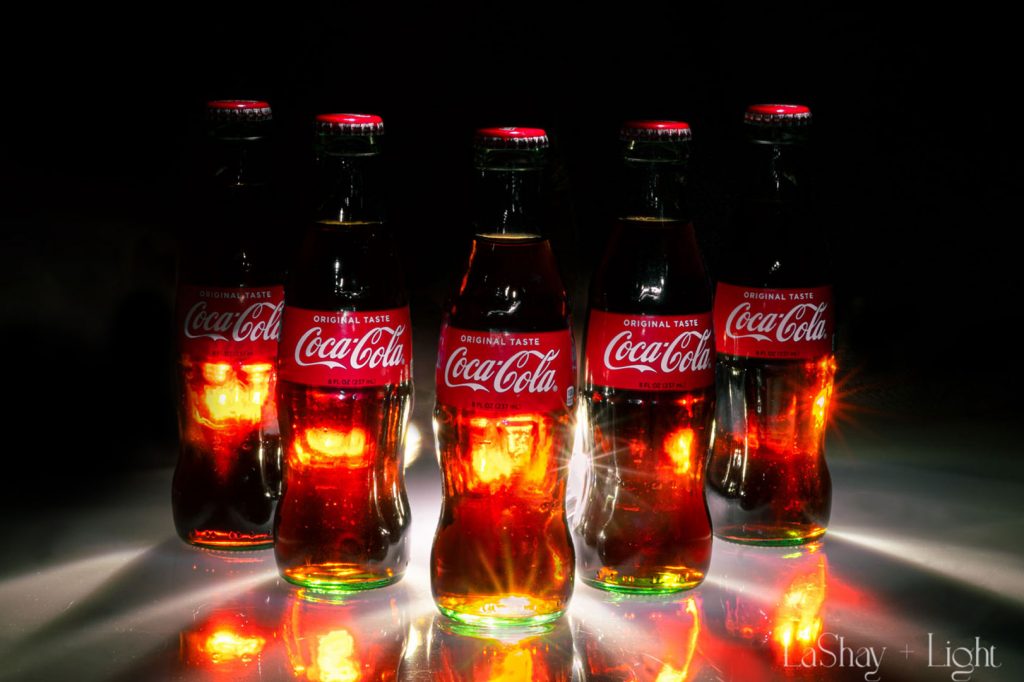 coca-cola bottles lit up light painting product photography starbursts