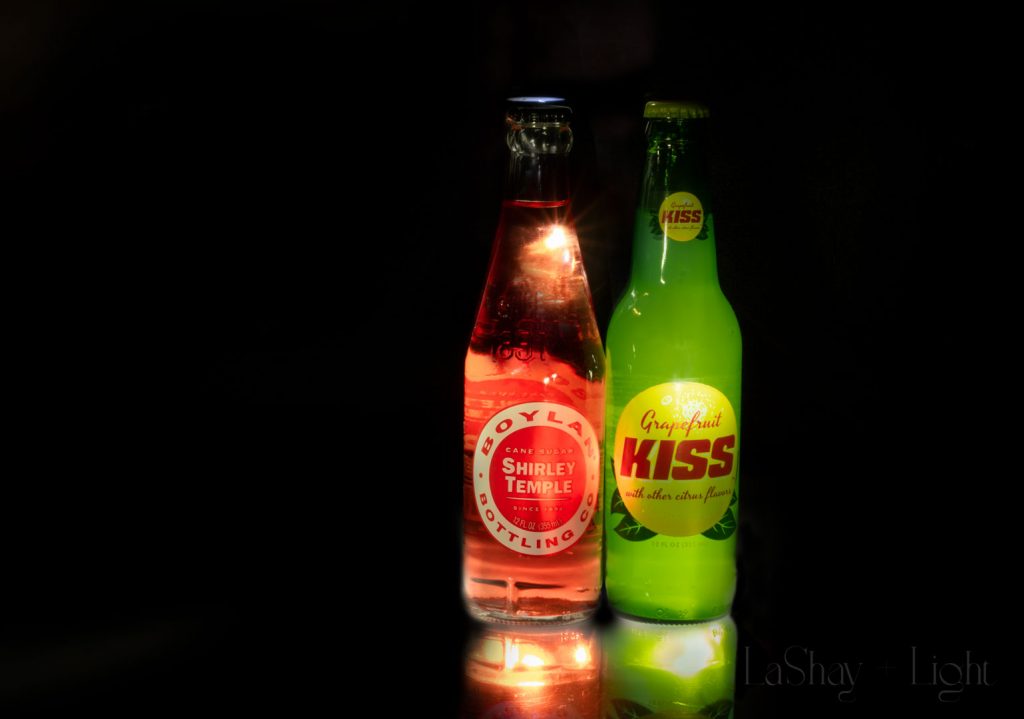 red and green soda bottles light painting products glowing