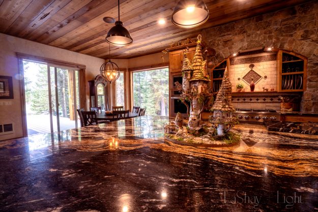rustic cabin interior decor in the kitchen with large whimsical fairy house as a centerpiece