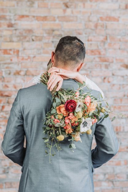 bridals in rigby bride hugging groom