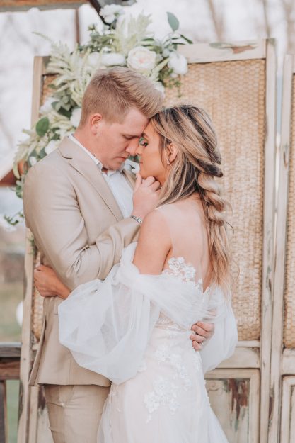 bride and groom holding each other