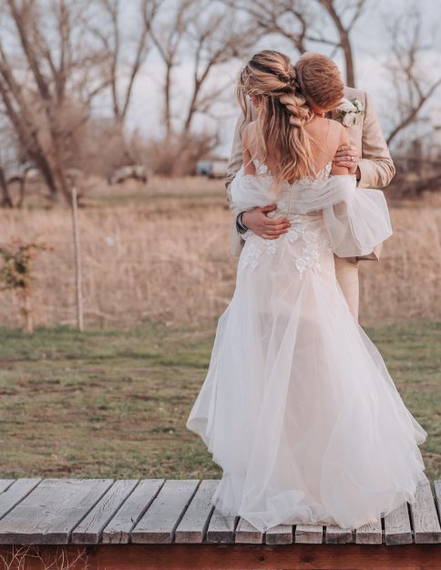 eloping vs wedding bride hugging groom elopement
