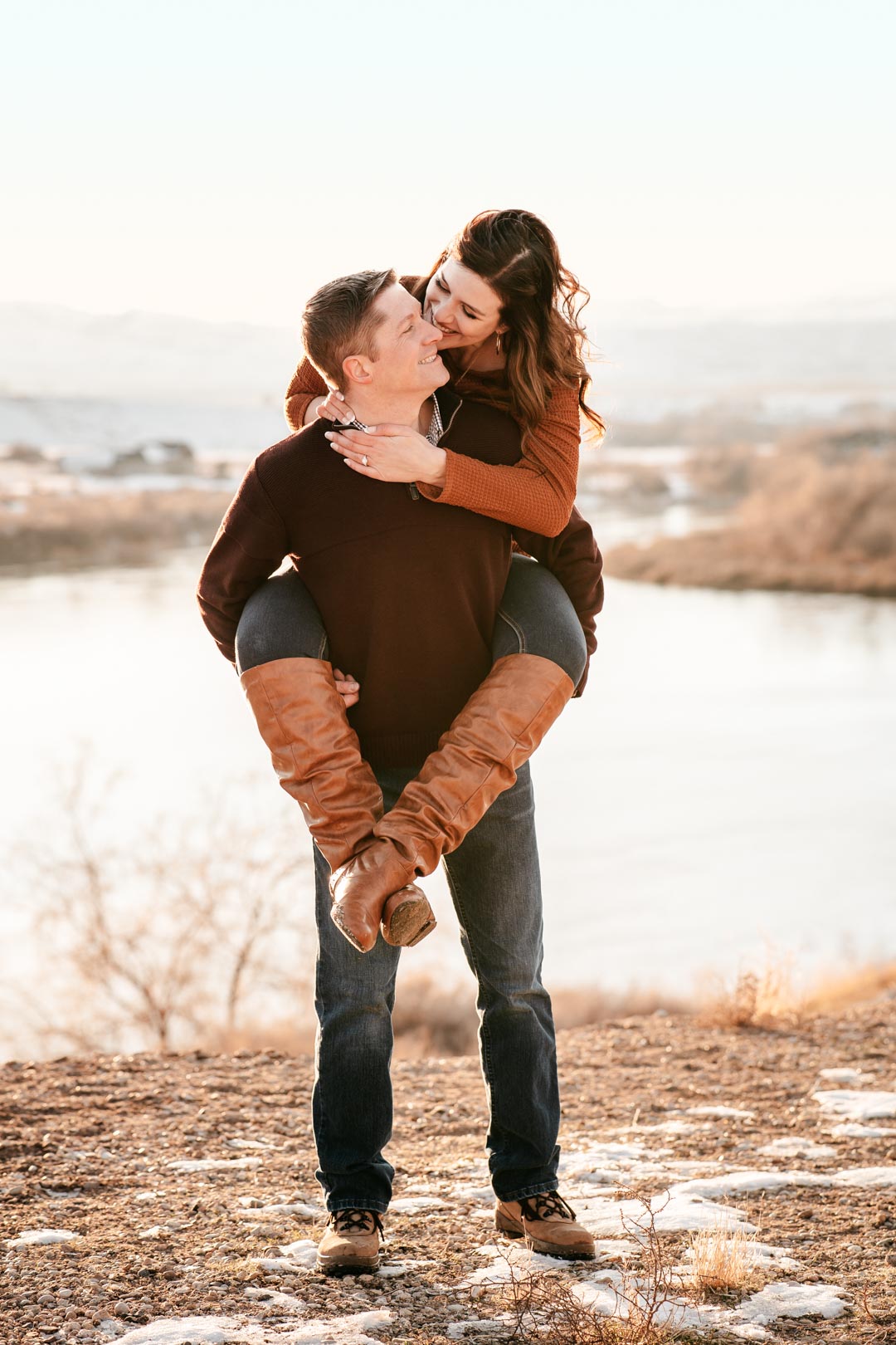 couple piggy back riding by snake river