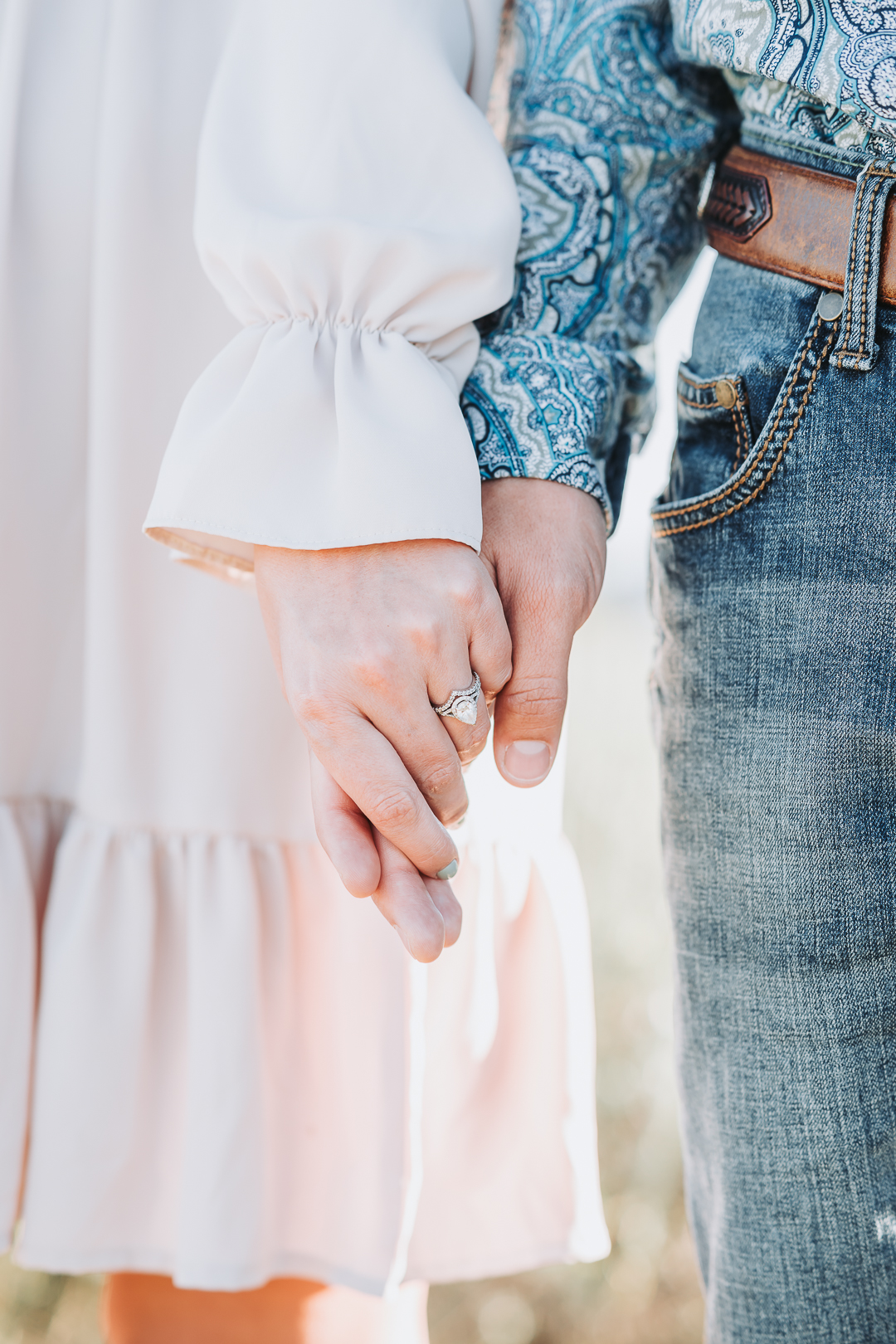 Couple holding hands Grand Teton couples photographer engagement