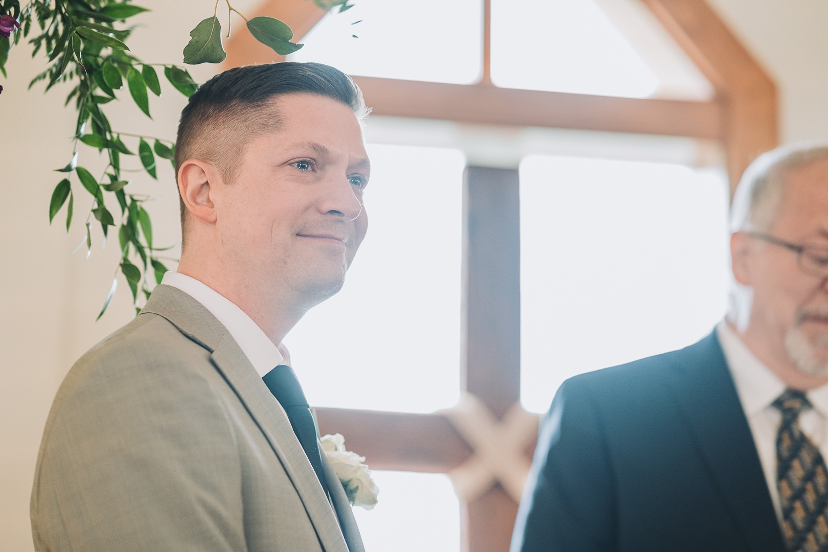 first look teary eyed groom looking at bride