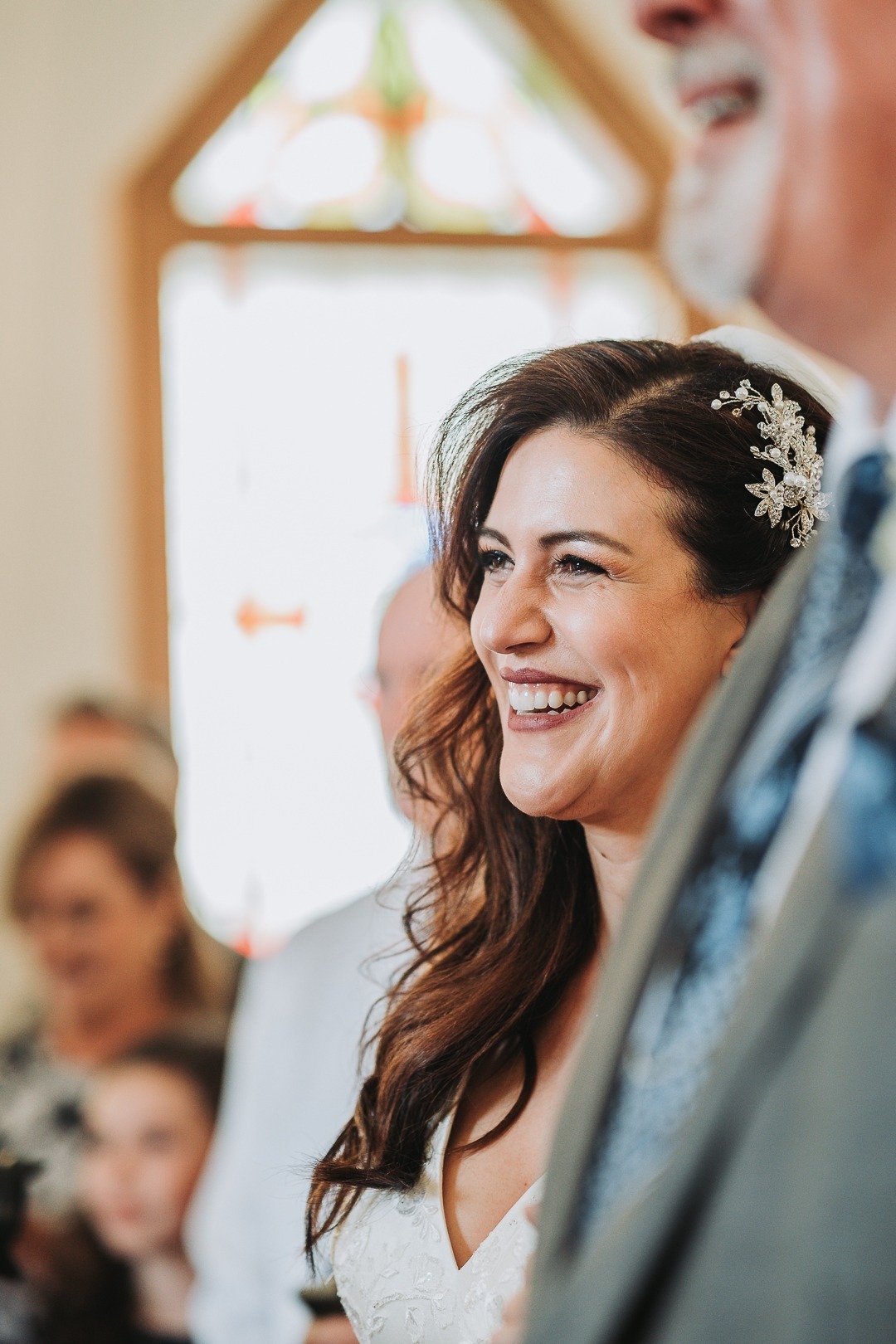 nampa bride smiling down the aisle romantic wedding photographer