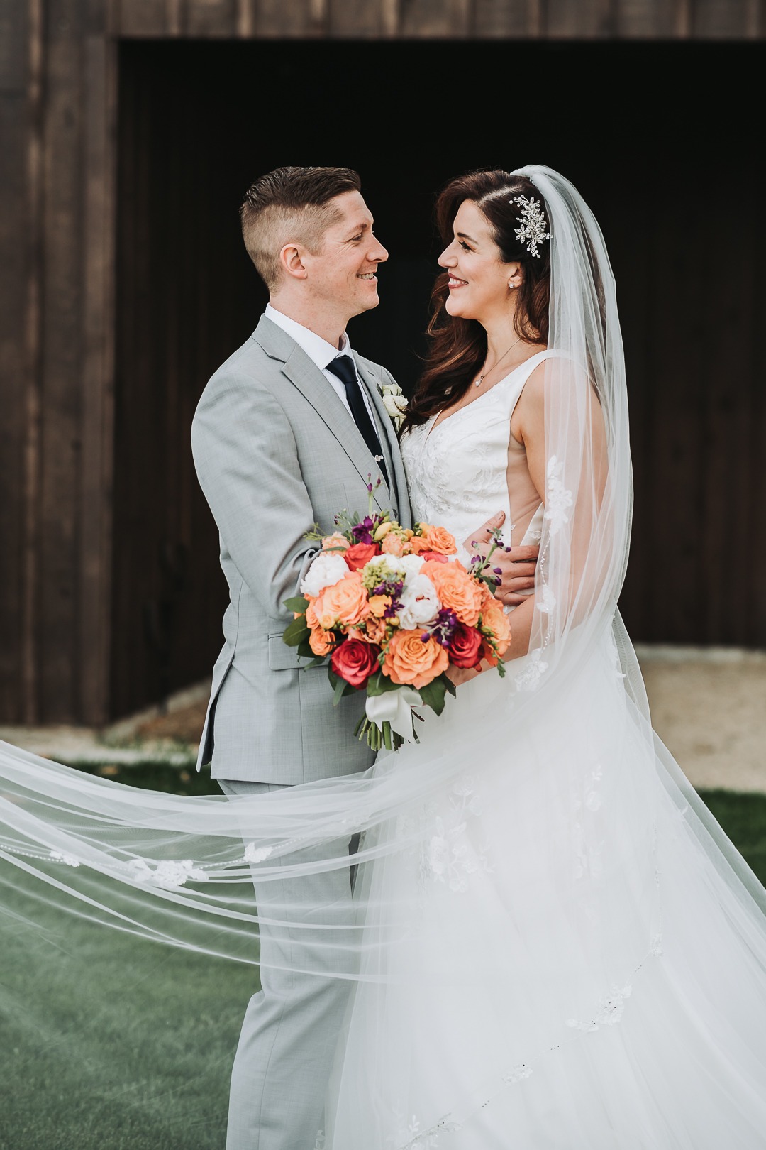bride and groom looking at each other