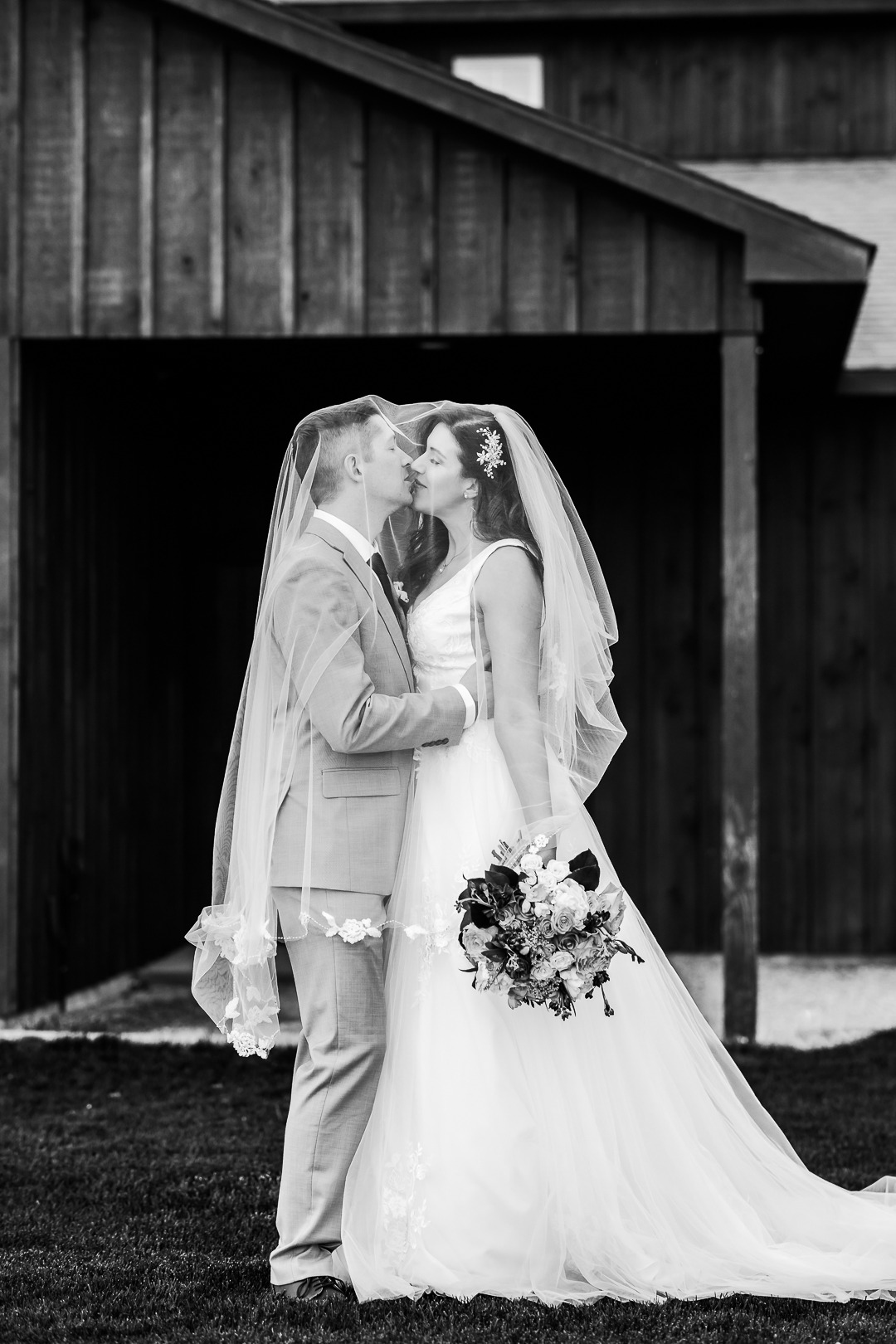 black and white groom and bride about to kiss
