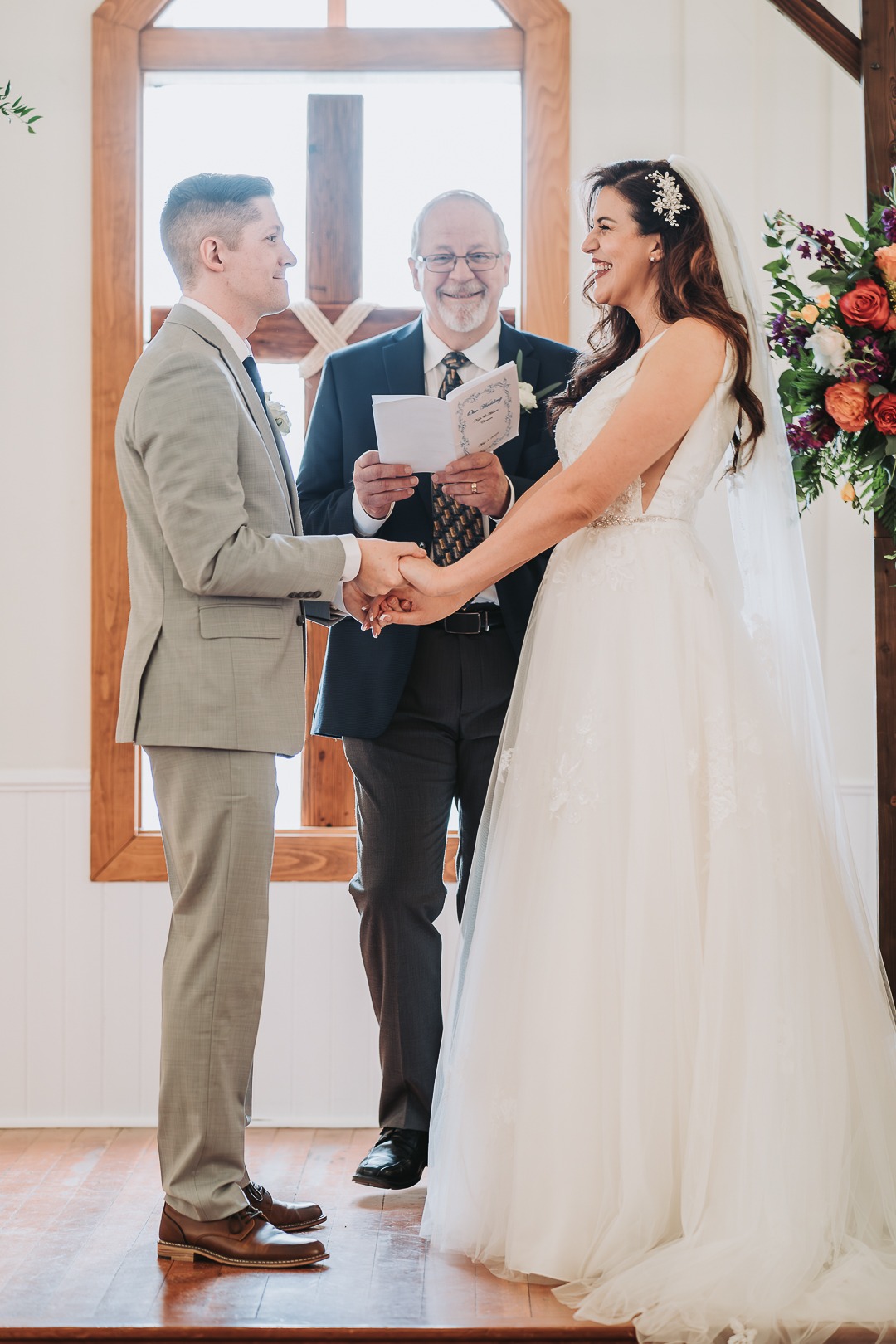 bride and groom smiling at each other during reception