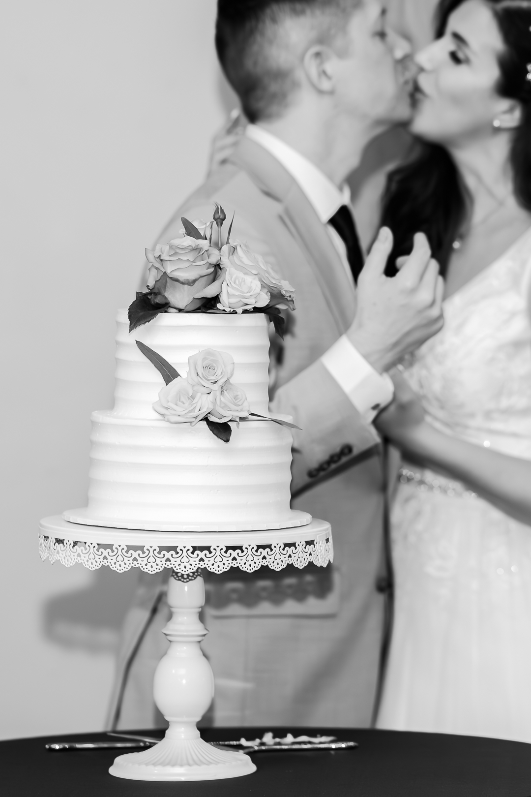 Cinematic black and white wedding photography with cake